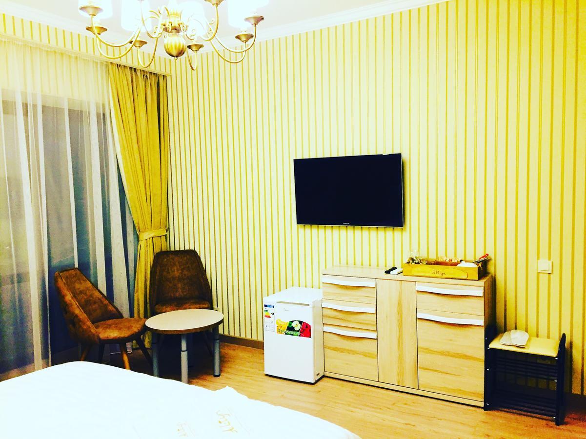 Altyn Aparthotel Astana Bagian luar foto